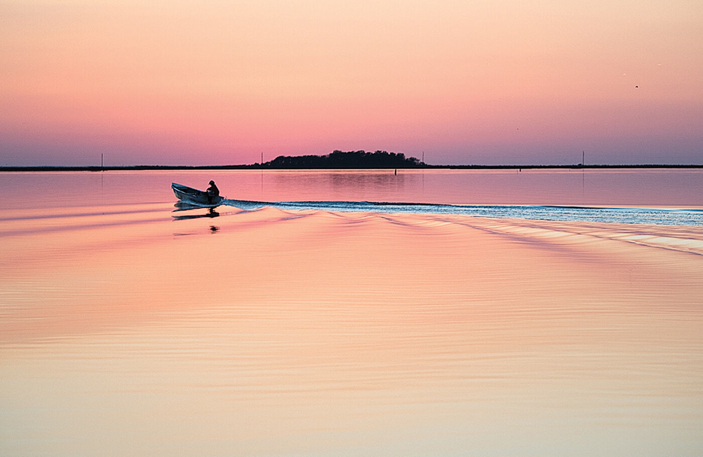 Skiff at sunset